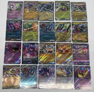 a bunch of pokemon cards sitting on top of a table