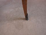a close up view of a wooden table with a black top