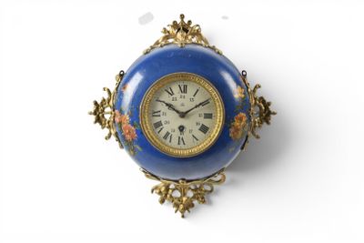 a blue and gold clock hanging on a wall