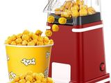 une machine à pop-corn et un seau de pop-corn posé à côté