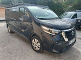 the black van is parked in the parking lot next to other cars