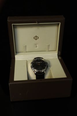 a watch that is in a box on a table