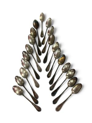 many spoons arranged in the shape of a christmas tree