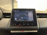 the dashboard of a car with a gps device in the center