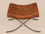 an image of a brown leather chair with a metal frame