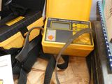 a yellow case that has a yellow and black device in it