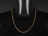 un collier à chaîne en or sur un mannequin mannequin mannequin mannequin mannequin mannequin mannequin mannequin mannequin mannequin