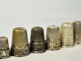 several different types of thimbles are lined up in a row
