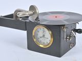 a clock that is sitting on top of a record