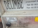 a sign on the side of a dumpster that says delimbe