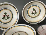 three bowls with designs on them are sitting on a table