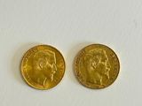 two gold coins with a woman ' s face and a man ' s head