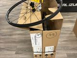 a bicycle wheel that is in a box on the floor