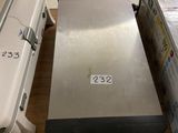a lot of boxes on the floor next to a refrigerator