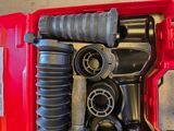 a red tool box with tools in it on a table