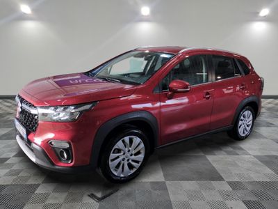 a red suv parked on a checkered floor in a garage