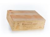 a wooden box with a label on it on a white background