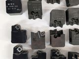 a lot of different types of clamps on a white surface