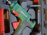 a cordless drill in a case with tools in it
