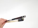 someone holding a pair of chopsticks in their hands