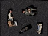 three figurines in a black box with a man on a motorcycle