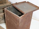 an old box with a lid sitting on the floor