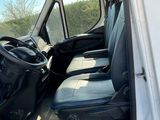 a white van that is parked on the side of the road