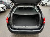 the back of a car with its trunk open in a parking lot