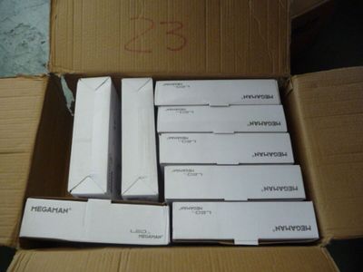 a cardboard box with a bunch of electronic items in it