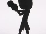 a black figurine of a man holding a boxing glove