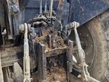 a tractor that is sitting in the dirt
