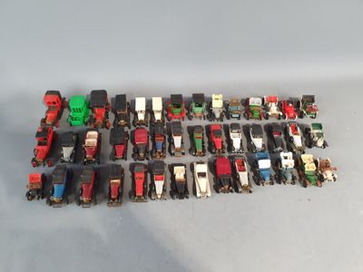 a lot of toy trains that are sitting on a table