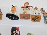 many figurines that are on display on a shelf