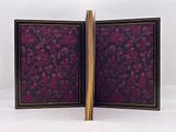 pair of antique handmade wooden picture frames with purple and black floral designs