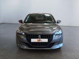 the front view of a grey car parked in a showroom