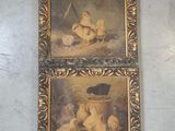 two paintings of cats and kittens are hanging on a wall