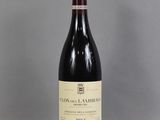a bottle of wine that is sitting on a table