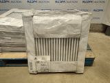 boxes of air conditioners are stacked on pallets in a warehouse