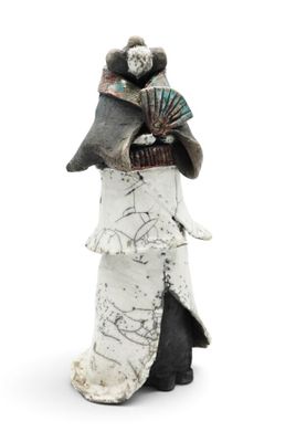 figurine of a woman with a fan and a fan in her hand