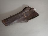a brown glove that is on a table