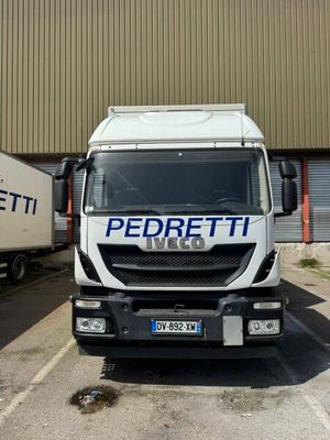 a white truck parked in front of a building