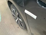 a car with a sticker on the side of it ' s door
