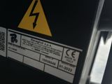 a close up of a parking meter with a sign on it