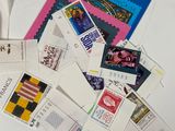 many different types of stamps on a white table
