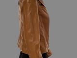 the back of a mannequin mannequin wearing a brown leather jacket