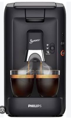 une machine à café Philips avec deux tasses de café devant elle