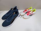 two pairs of puma shoes on a white table