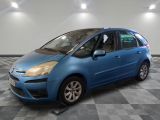 a picture of a blue car parked in a garage