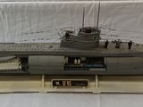 a model of a submarine on display on a white surface