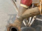 a close up of a water hose attached to the side of a boat